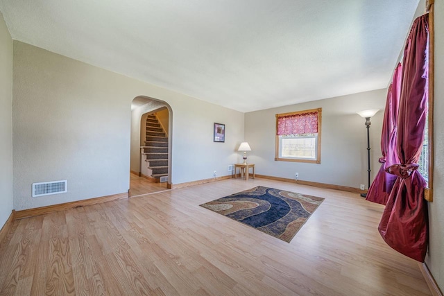 2780 Humboldt Rd, Green Bay, WI 54311 - sitting room with wood finished floors, arched walkways, stairway, and baseboards