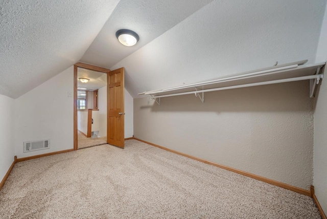 2780 Humboldt Rd, Green Bay, WI 54311 - walk in closet with light carpet and vaulted ceiling