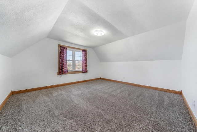2780 Humboldt Rd, Green Bay, WI 54311 - bonus room with a textured ceiling, baseboards, carpet flooring, and vaulted ceiling