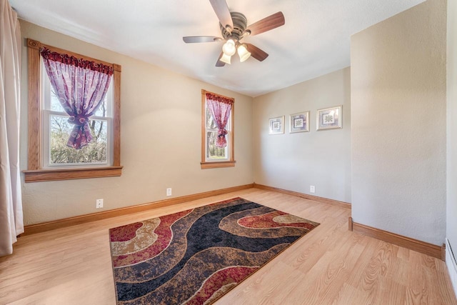 2780 Humboldt Rd, Green Bay, WI 54311 - empty room featuring wood finished floors, a ceiling fan, and baseboards