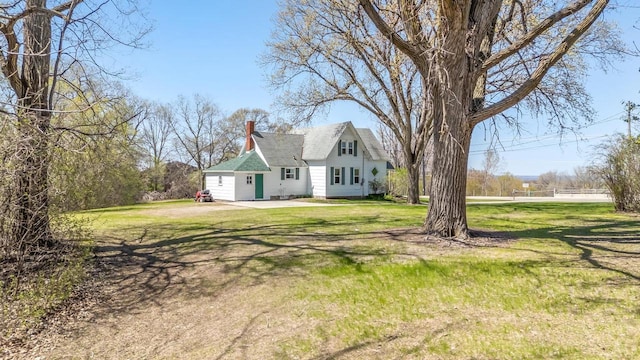2780 Humboldt Rd, Green Bay, WI 54311 - view of side of home with a lawn and a chimney
