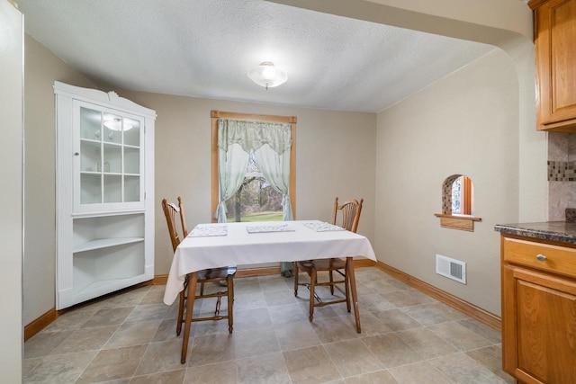 2780 Humboldt Rd, Green Bay, WI 54311 - dining area with a textured ceiling and baseboards