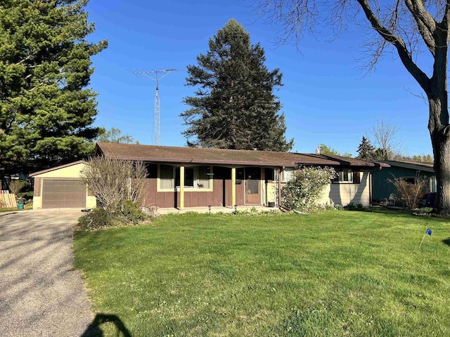 120 Hickory Ln, Waterloo, WI 53594 - ranch-style home with asphalt driveway, a front lawn, and an attached garage