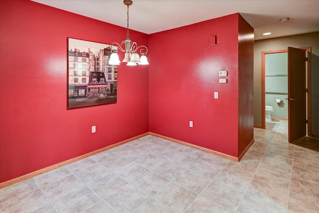 7910 N Brookline Dr, Madison, WI 53719 - empty room with a chandelier, baseboards, and a smoke detector