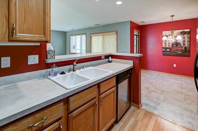 7910 N Brookline Dr, Madison, WI 53719 - kitchen with a sink, dishwasher, brown cabinetry, a chandelier, and recessed lighting