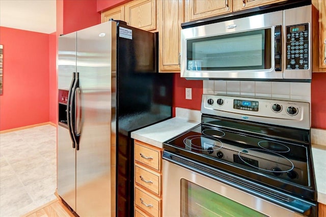 7910 N Brookline Dr, Madison, WI 53719 - kitchen featuring stainless steel appliances, light countertops, and backsplash