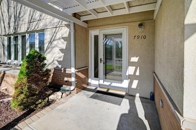 7910 N Brookline Dr, Madison, WI 53719 - entrance to property featuring stucco siding and brick siding
