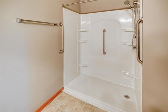 7910 N Brookline Dr, Madison, WI 53719 - full bathroom featuring a shower, baseboards, and tile patterned floors