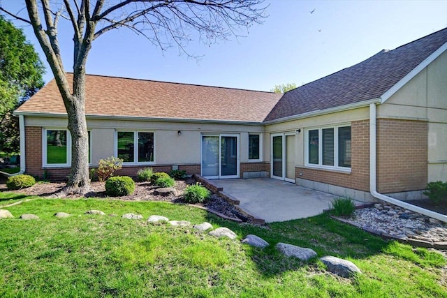 7910 N Brookline Dr, Madison, WI 53719 - back of house with brick siding, a patio, and roof with shingles