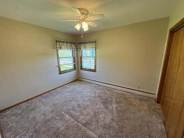 201 Broadway St, Rollingstone, MN 55969 - unfurnished bedroom with a baseboard heating unit, carpet floors, baseboards, and a ceiling fan