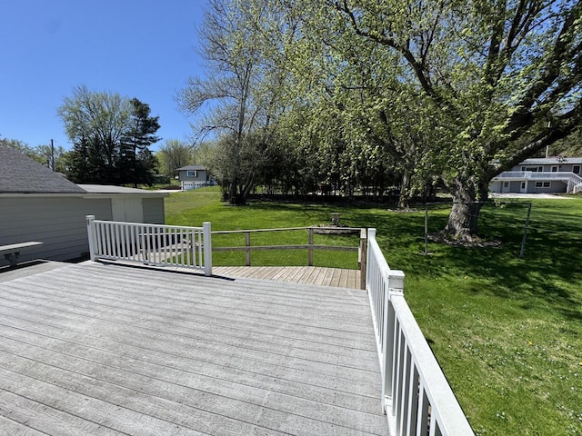 201 Broadway St, Rollingstone, MN 55969 - wooden deck featuring a yard