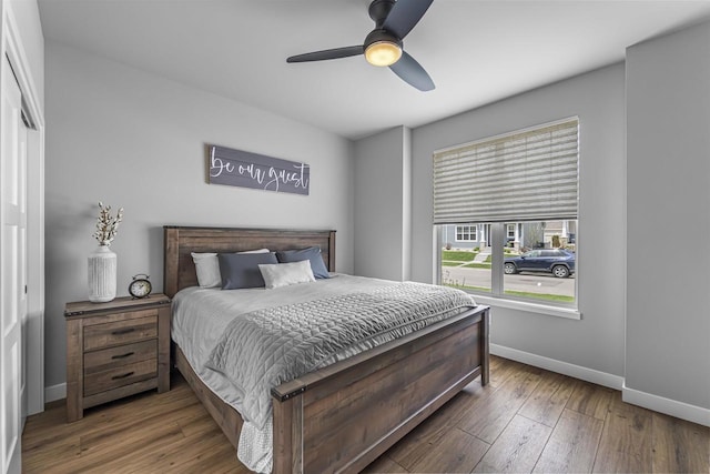 2149 Rosenberg Ln, Sun Prairie, WI 53590 - bedroom with baseboards, wood-type flooring, and a ceiling fan