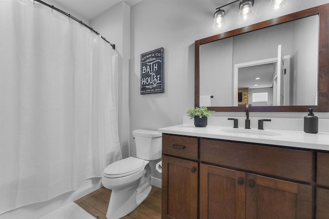 2149 Rosenberg Ln, Sun Prairie, WI 53590 - full bath with toilet, vanity, wood finished floors, and shower / bathtub combination with curtain