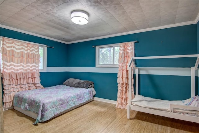 19333 59th Ave, Chippewa Falls, WI 54729 - bedroom featuring multiple windows, wood finished floors, baseboards, and crown molding