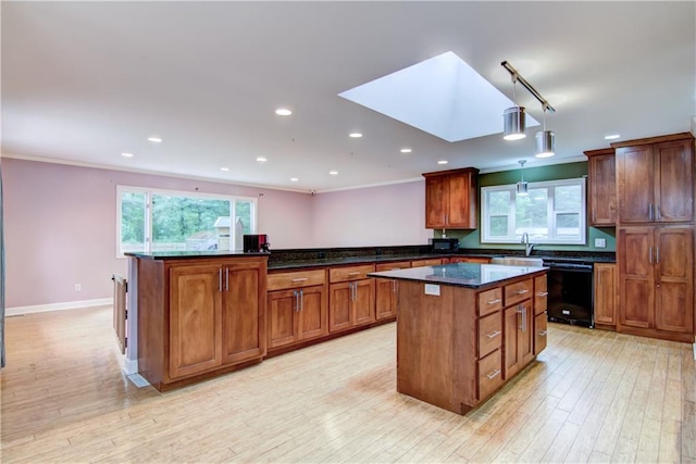 19333 59th Ave, Chippewa Falls, WI 54729 - kitchen with dishwasher, a center island, healthy amount of natural light, a sink, and ornamental molding