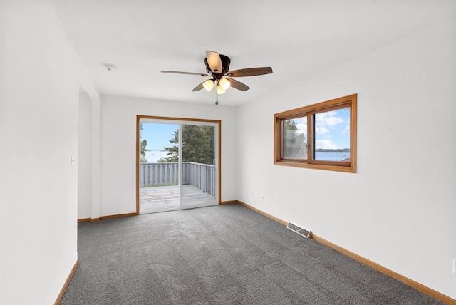 W10723 Blackhawk Trl Unit 4, Fox Lake, WI 53933 - carpeted spare room with ceiling fan, baseboards, and a smoke detector