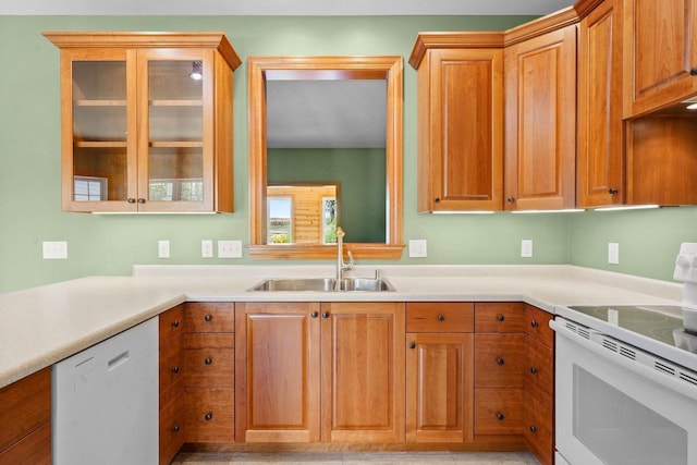 2210 Alban Ln, Prairie Du Sac, WI 53578 - kitchen with white appliances, a sink, glass insert cabinets, light countertops, and brown cabinets