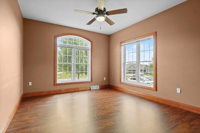 2210 Alban Ln, Prairie Du Sac, WI 53578 - unfurnished room with wood finished floors, baseboards, and ceiling fan