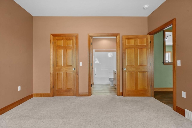 2210 Alban Ln, Prairie Du Sac, WI 53578 - carpeted bedroom with baseboards and ensuite bathroom