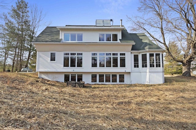 1229 Riverwood Ln, Sobieski, WI 02413 - rear view of property featuring roof with shingles and a sunroom