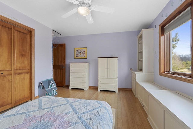 1229 Riverwood Ln, Sobieski, WI 02413 - bedroom with light wood finished floors, a ceiling fan, and baseboards