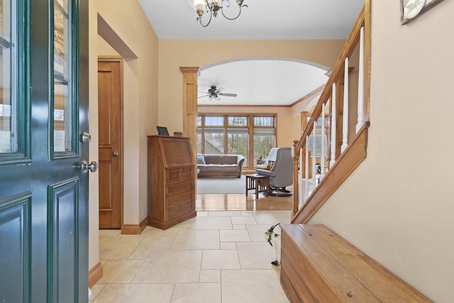 1229 Riverwood Ln, Sobieski, WI 02413 - entryway featuring arched walkways, stairs, baseboards, ceiling fan, and a chandelier