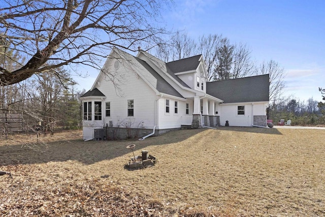 1229 Riverwood Ln, Sobieski, WI 02413 - view of home's exterior with roof with shingles, central AC, and stone siding