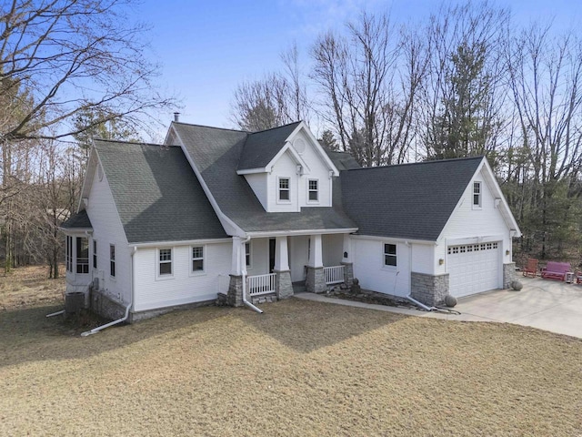 1229 Riverwood Ln, Sobieski, WI 02413 - view of front of home with a porch, stone siding, concrete driveway, a front yard, and roof with shingles