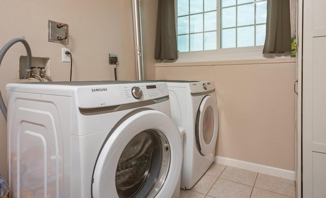 N2664 Grand Path, Wautoma, WI 54982 - washroom with separate washer and dryer, light tile patterned floors, and baseboards