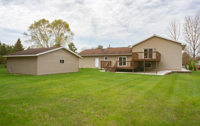 N2664 Grand Path, Wautoma, WI 54982 - back of property with a wooden deck, a yard, and an outdoor structure