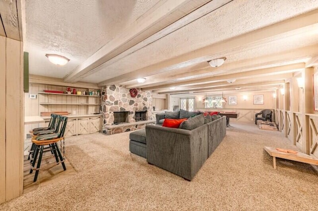 15555 Esser Ct, Brookfield, WI 53005 - living room featuring a textured ceiling, a fireplace, carpet floors, and beam ceiling
