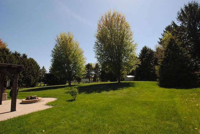 1116 Redwood Ct, Delavan, WI 53115 - view of property's community featuring an outdoor fire pit, a yard, and a patio