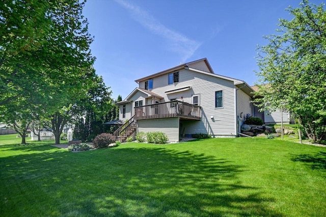 717 Larvik Ln, Stoughton, WI 53589 - rear view of house featuring a wooden deck, a lawn, and stairway