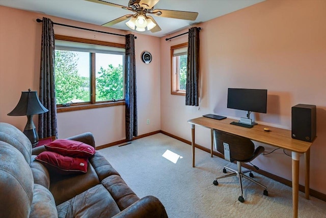 717 Larvik Ln, Stoughton, WI 53589 - home office featuring carpet, plenty of natural light, baseboards, and a ceiling fan