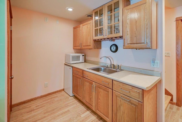 717 Larvik Ln, Stoughton, WI 53589 - kitchen featuring white microwave, dishwasher, a sink, light countertops, and recessed lighting