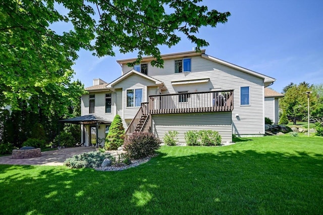 717 Larvik Ln, Stoughton, WI 53589 - back of house with a yard, stairs, and a wooden deck