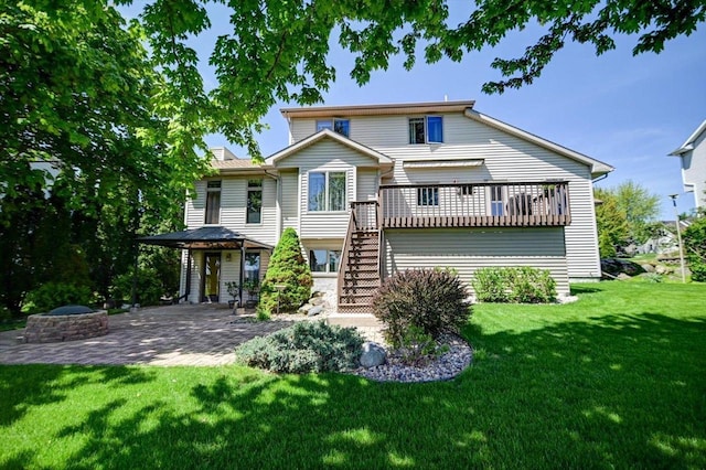 717 Larvik Ln, Stoughton, WI 53589 - rear view of property with stairs, a patio, a yard, and a wooden deck