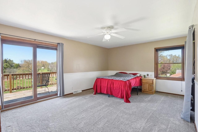 W156N10303 Pilgrim Rd, Germantown, WI 53022 - carpeted bedroom with multiple windows, access to exterior, baseboards, and a ceiling fan