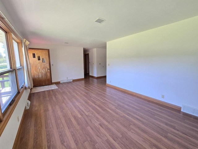 705 W Taylor St, Plainfield, WI 54966 - empty room featuring wood finished floors and baseboards