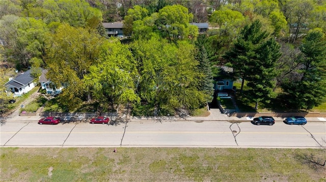 drone / aerial view of a tree filled landscape
