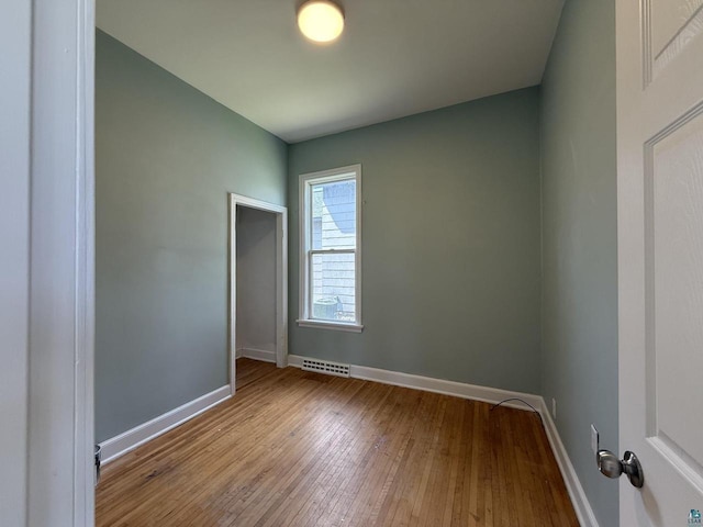 613 Vaughn Ave, Ashland, WI 54806 - unfurnished room with wood-type flooring and baseboards