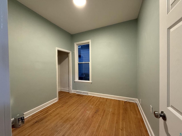 613 Vaughn Ave, Ashland, WI 54806 - empty room with baseboards and wood finished floors