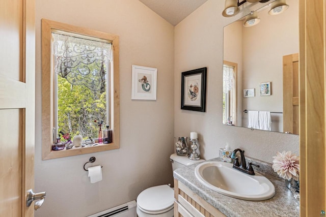 87985 Bark Point Rd, Herbster, WI 54844 - half bathroom with toilet, vanity, and vaulted ceiling
