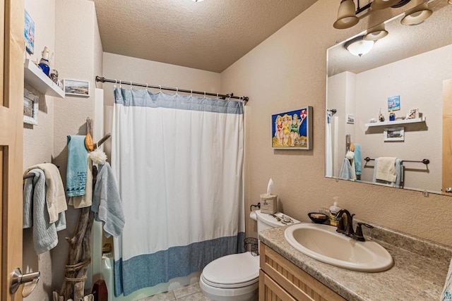 87985 Bark Point Rd, Herbster, WI 54844 - full bath with vanity, a textured ceiling, toilet, a textured wall, and tile patterned floors