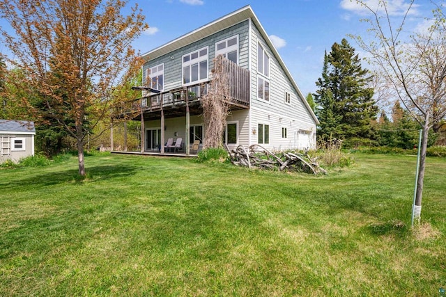 87985 Bark Point Rd, Herbster, WI 54844 - back of house with a yard, a deck, and an attached garage