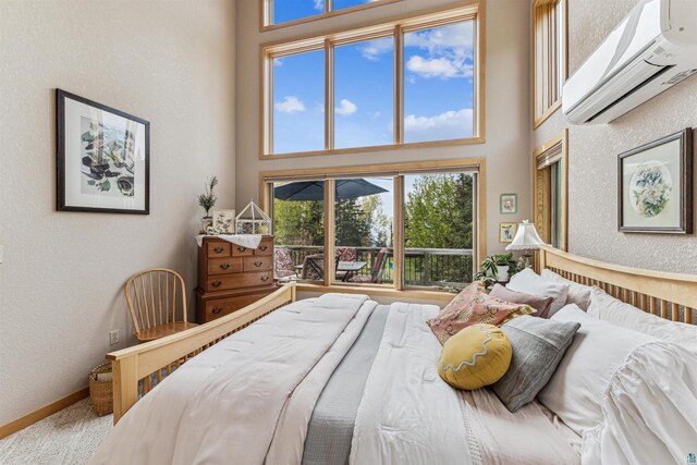 87985 Bark Point Rd, Herbster, WI 54844 - bedroom with an AC wall unit, a towering ceiling, and a textured wall