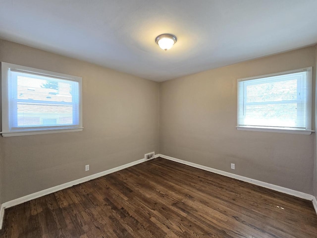 6321 W Keefe Avenue Parkway Unit 6323, Milwaukee, WI 53216 - unfurnished room featuring baseboards and dark wood finished floors