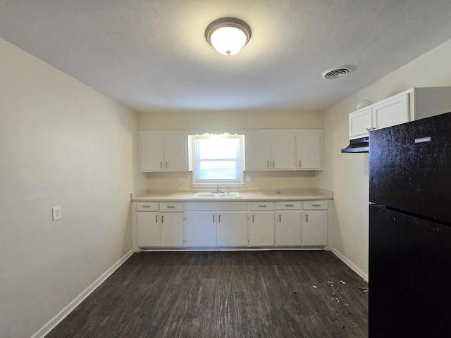 6321 W Keefe Avenue Parkway Unit 6323, Milwaukee, WI 53216 - kitchen featuring freestanding refrigerator, a sink, dark wood finished floors, and baseboards