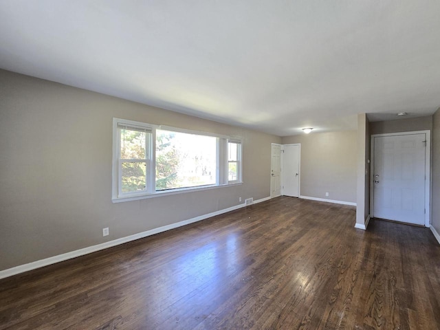 6321 W Keefe Avenue Parkway Unit 6323, Milwaukee, WI 53216 - empty room with baseboards and dark wood-style flooring