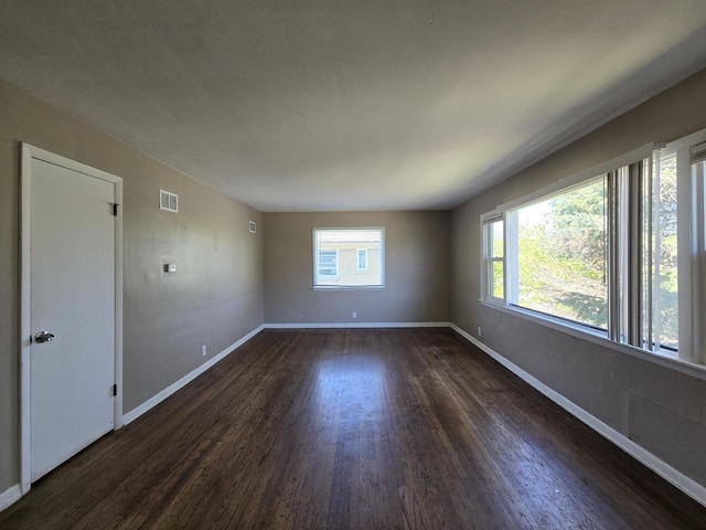 6321 W Keefe Avenue Parkway Unit 6323, Milwaukee, WI 53216 - empty room with dark wood-style floors and baseboards